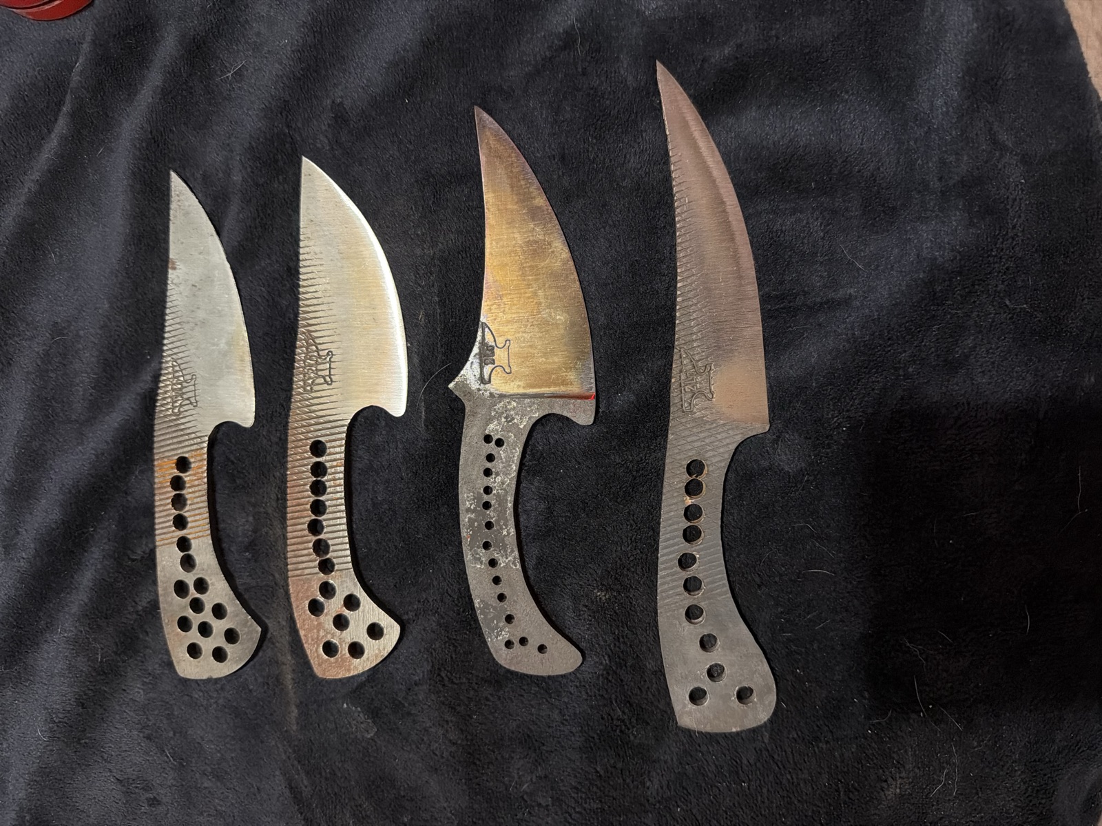 Four shaped Tulos blade blanks before their handles are fitted