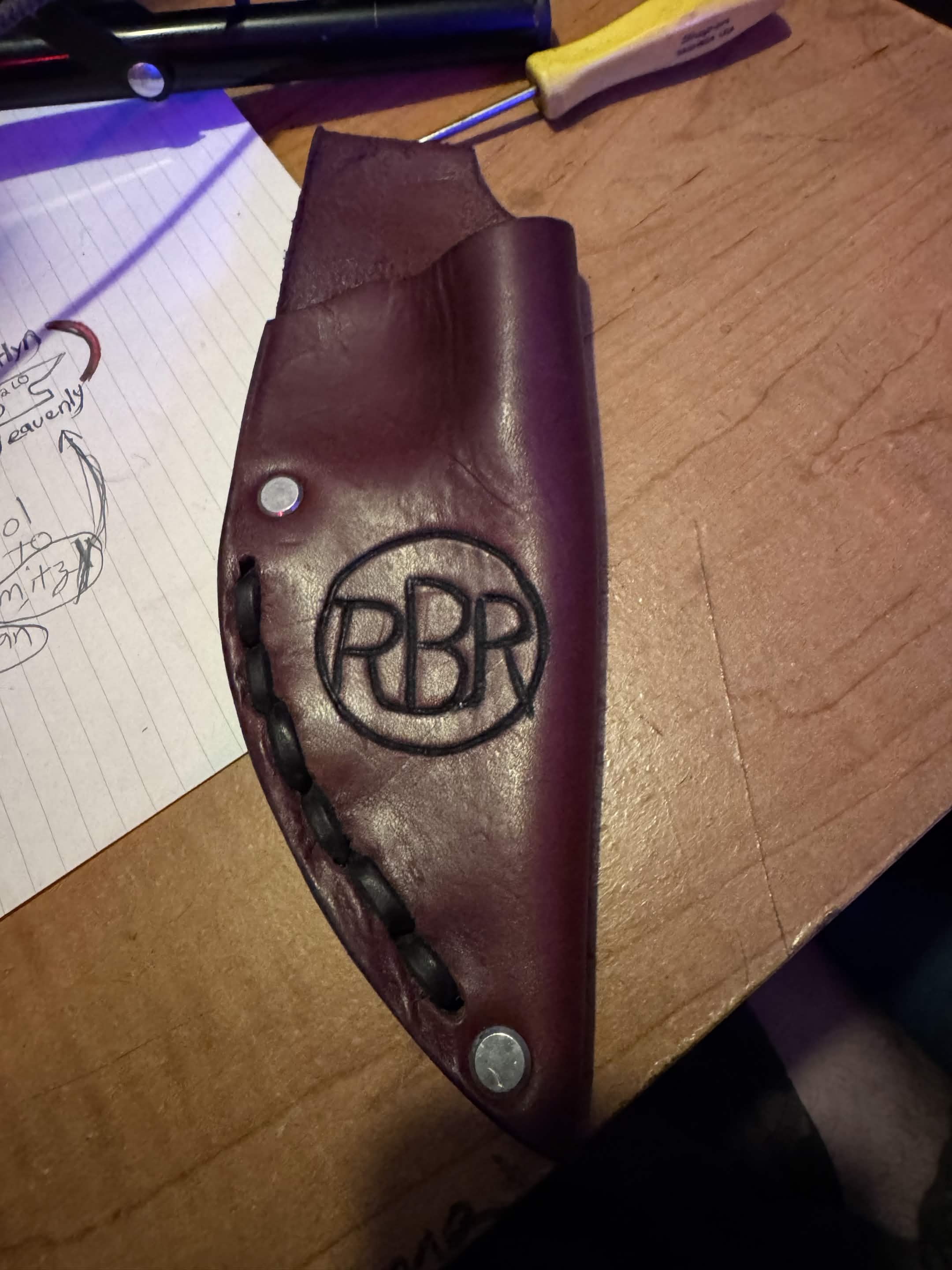 Hand-tooled burgundy leather knife sheath stamped RBR